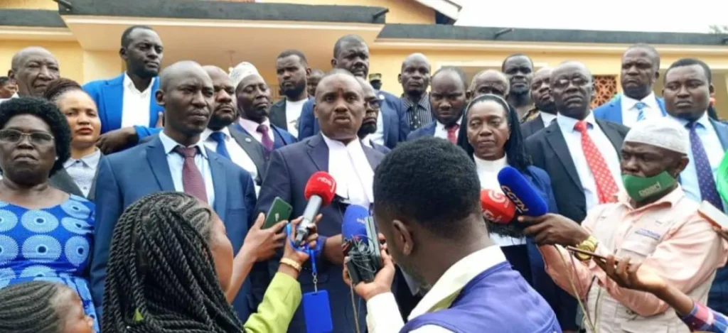 Dr. Kizza Besigye’s legal team addresses journalists after a court session where Besigye and his co-accused, Haji Obeid Lutale, were remanded in December 2024