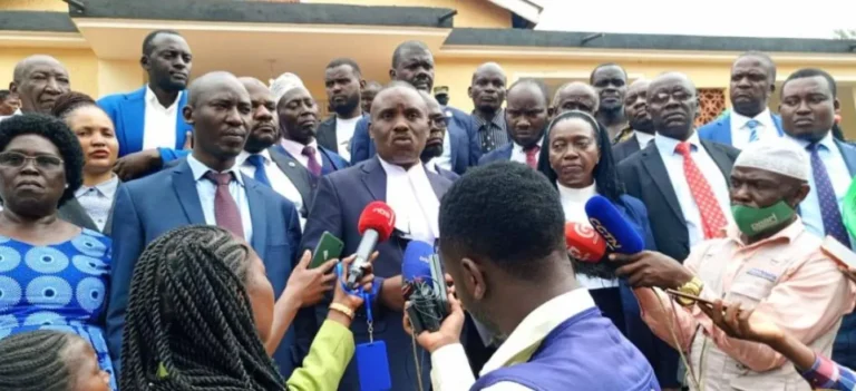 Dr. Kizza Besigye’s legal team addresses journalists after a court session where Besigye and his co-accused, Haji Obeid Lutale, were remanded in December 2024